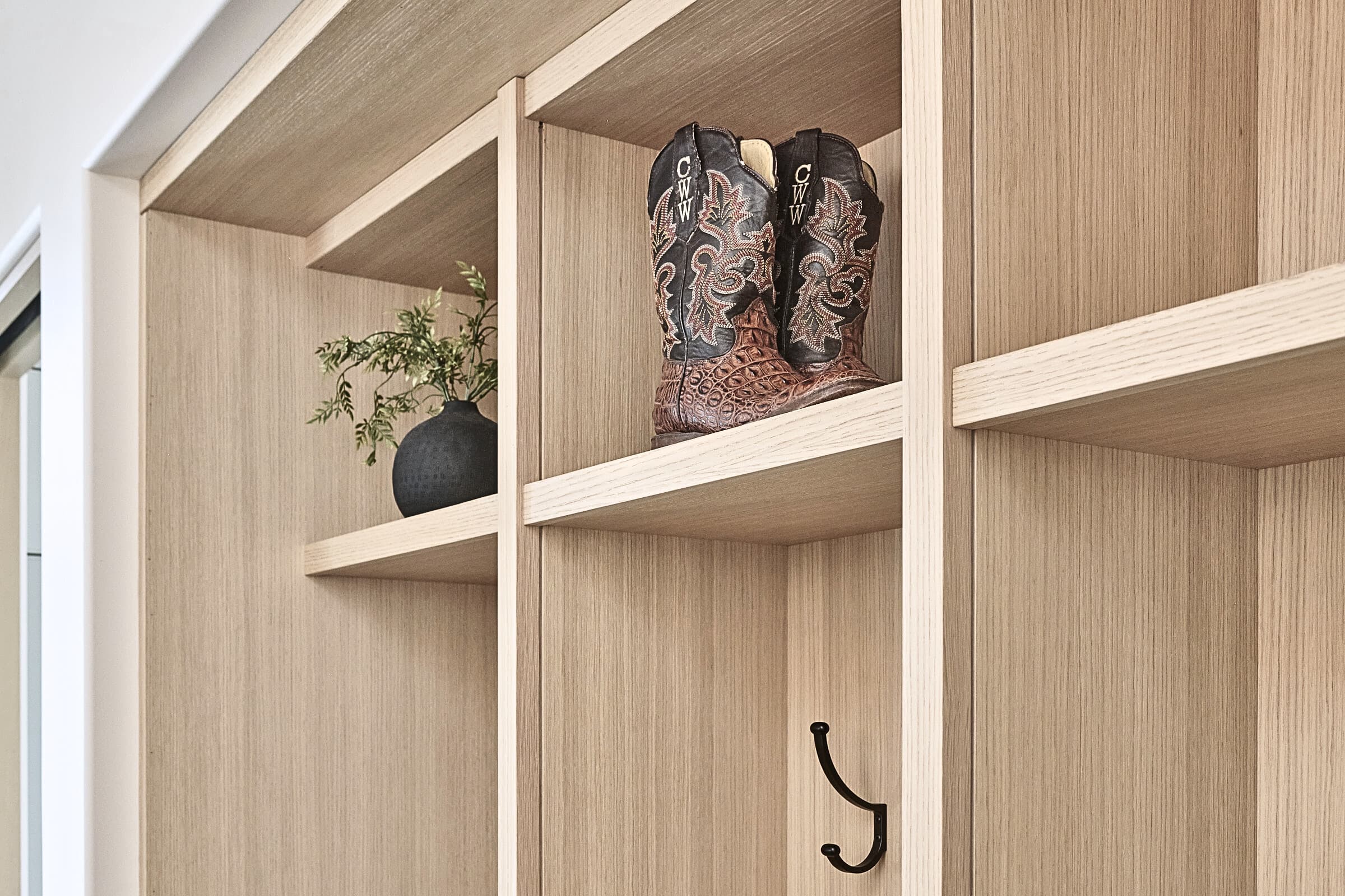 Bespoke custom cabinetry in Full Stretch: Rift White Oak Boot Cubbies